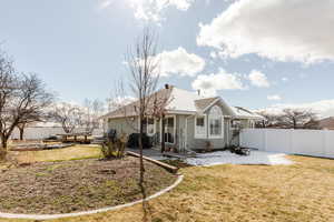 Back of house with a fenced backyard, a patio area, and stucco siding