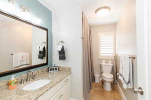 Full bathroom featuring vanity and a shower with shower curtain