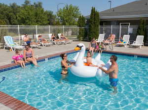 Community pool with a patio