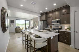 Sleek quartz countertops and modern cabinetry create a stylish yet functional space.