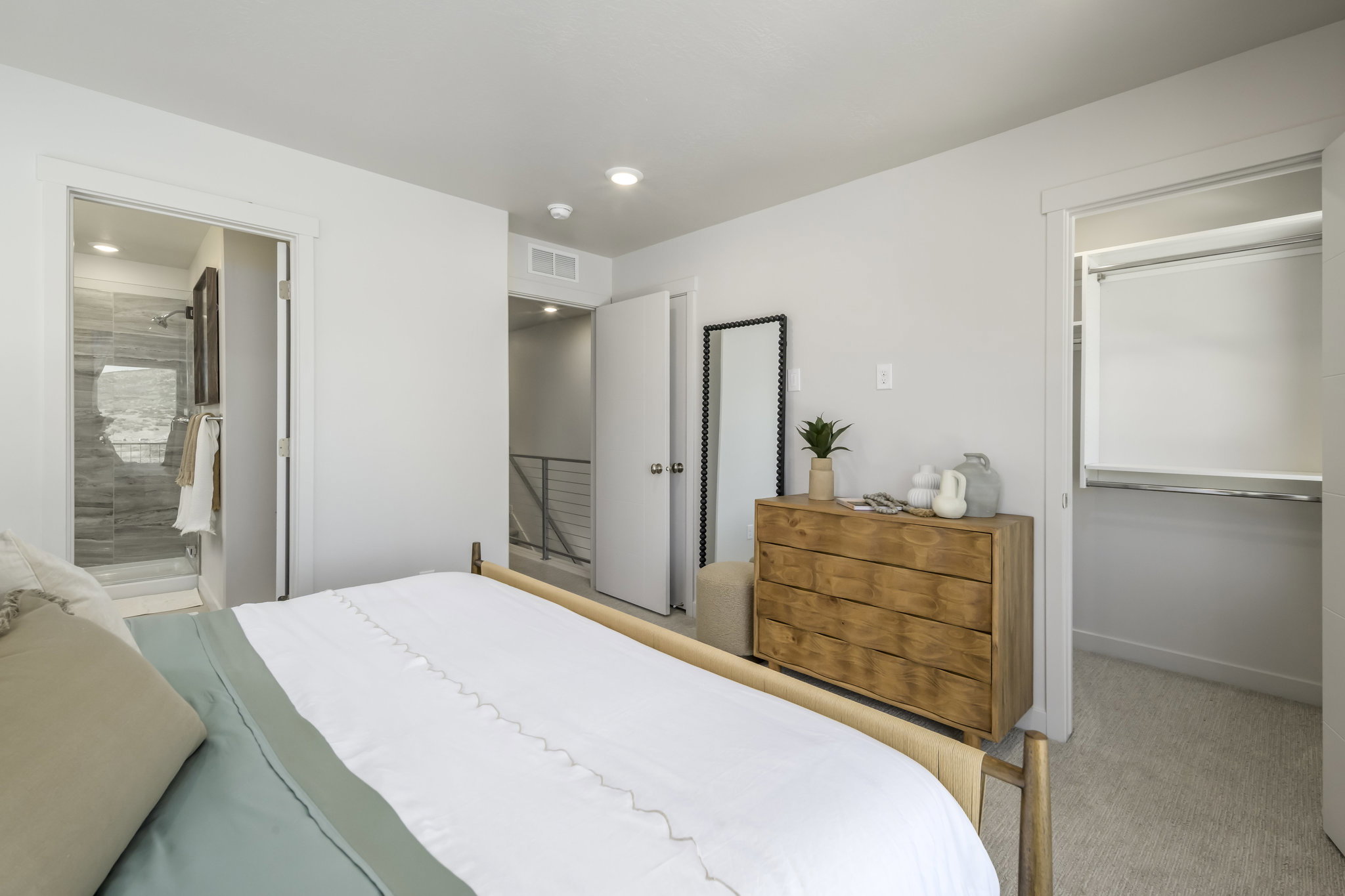 Bedroom featuring light-colored walls and soft carpet flooring