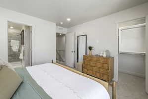 Bedroom featuring light-colored walls and soft carpet flooring