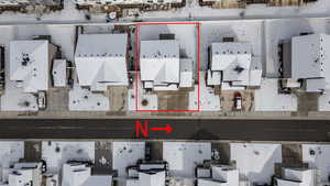 Aerial perspective of suburban area featuring property boundaries highlighted