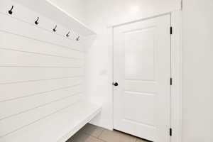 Mudroom featuring light tile patterned floors