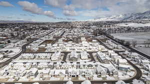 Aerial view of residential area featuring a mountainous background