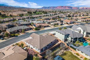 Aerial view of residential area featuring a mountain backdrop