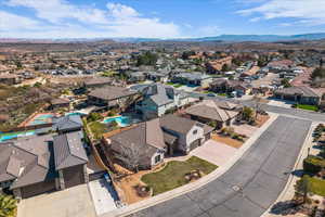 Aerial view of residential area featuring a mountain backdrop