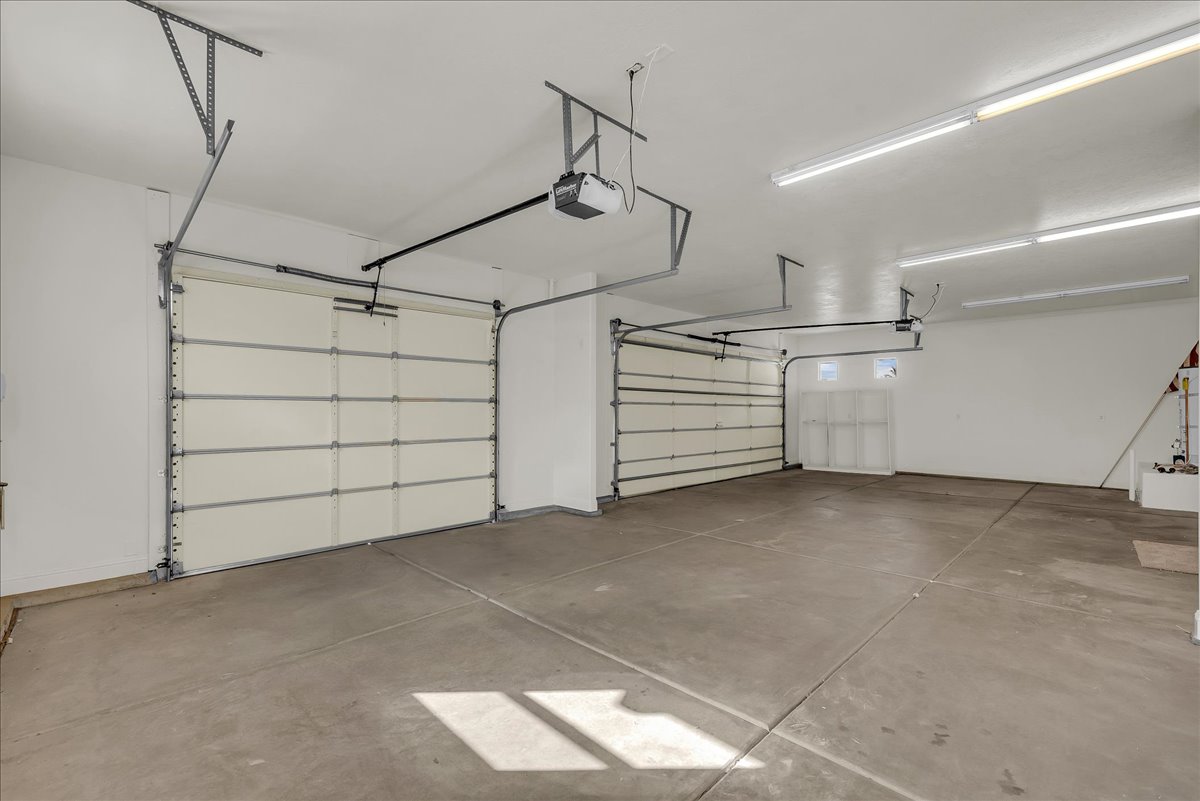 Garage featuring a garage door opener