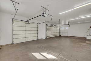 Garage featuring a garage door opener