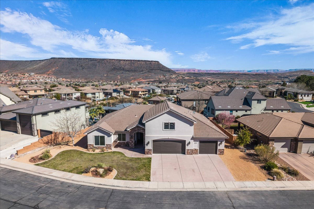 Aerial view of residential area with a mountainous background