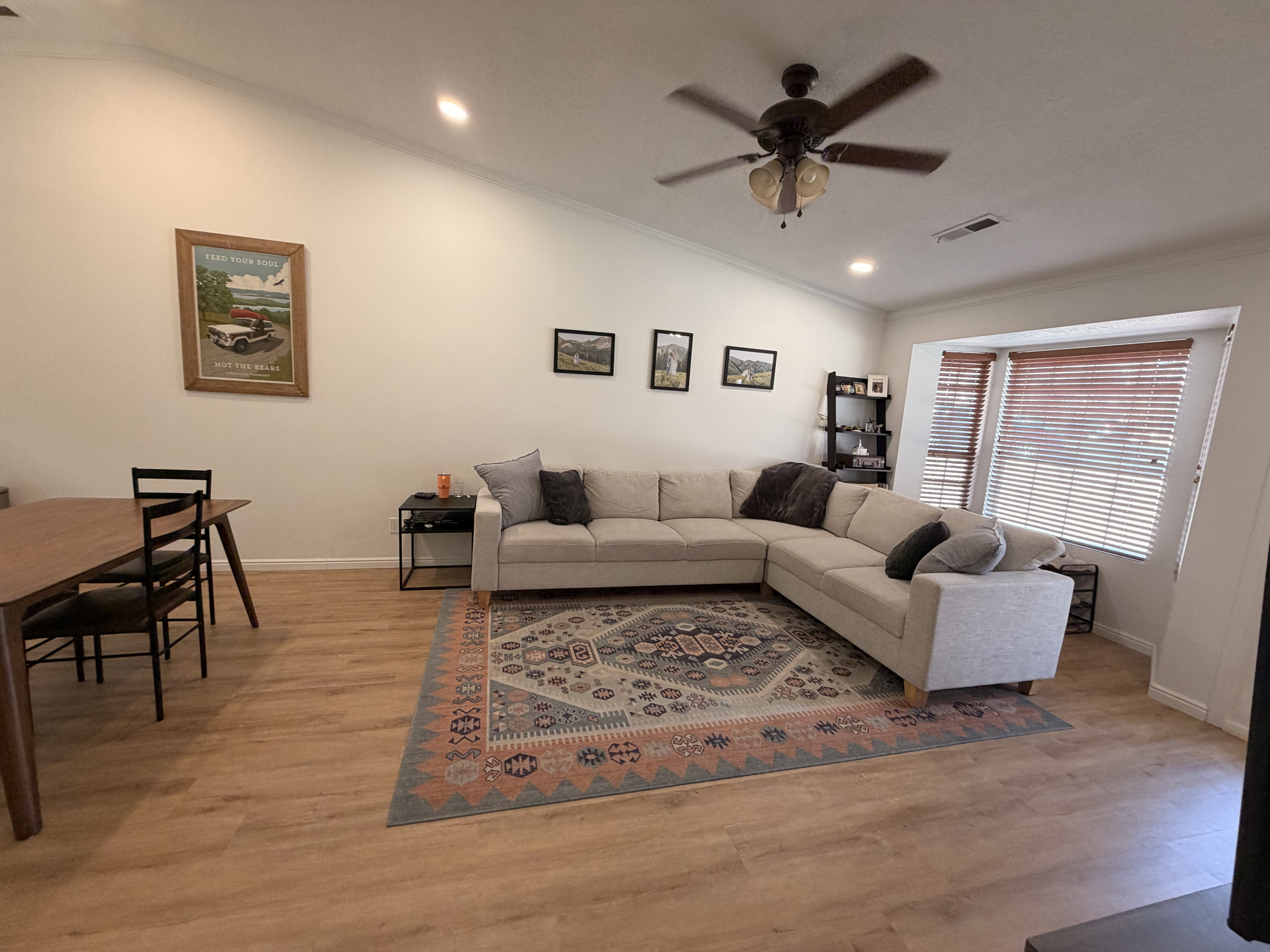 Living room featuring a ceiling fan, recessed lighting, light wood-style floors, and ornamental molding