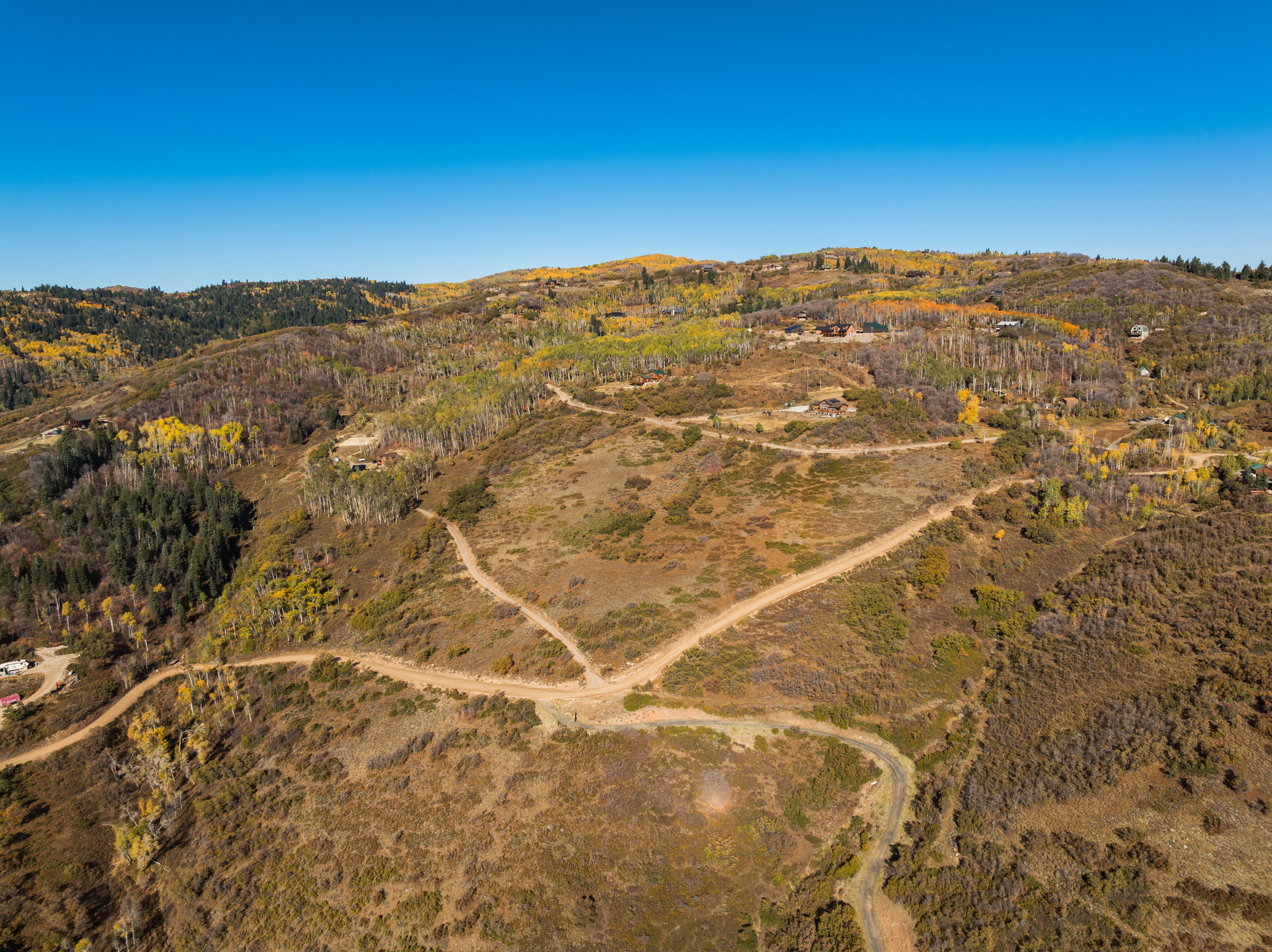Aerial view of sparsely populated area featuring a mountain backdrop