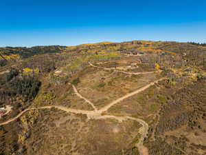 Aerial view of sparsely populated area featuring a mountain backdrop