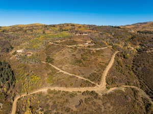 Aerial view of sparsely populated area featuring a mountain backdrop