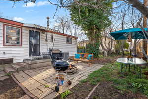 View of patio / terrace featuring an outdoor fire pit
