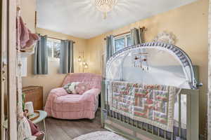 Sitting room featuring hardwood / wood-style floors