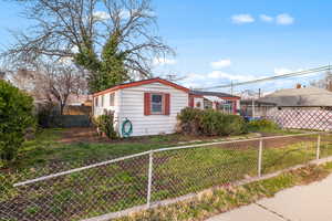 View of side of home with a fenced backyard