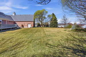 View of yard with a deck