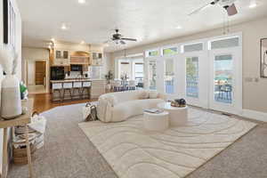 Living area with ceiling fan and recessed lighting