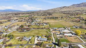 View of property location featuring nearby suburban area and rural landscape