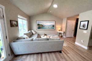 TV is AI , another view with couch in different spot .