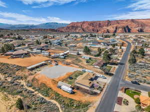 View of property location featuring a mountainous background and nearby suburban area