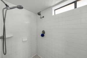 Bathroom with a tile shower
