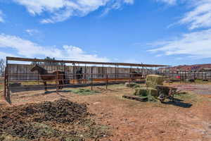 View of yard featuring an outdoor structure, an exterior structure, and a mountain view