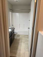 Full bathroom featuring vanity and  shower combination