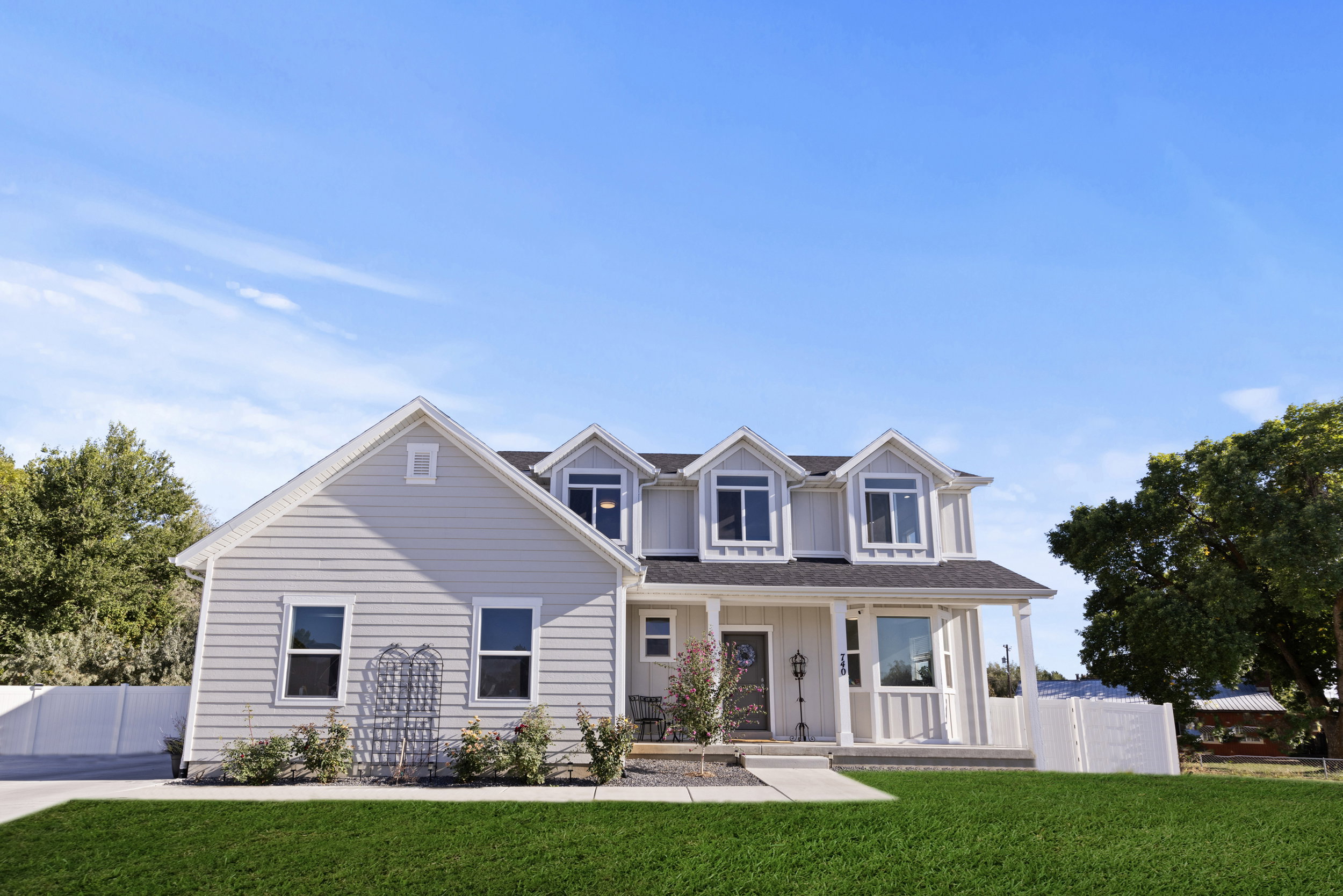 View of front of house with a porch and board and batten siding