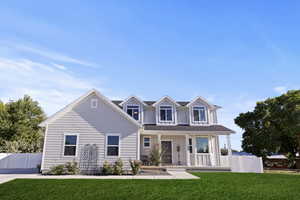 View of front of house with a porch and board and batten siding