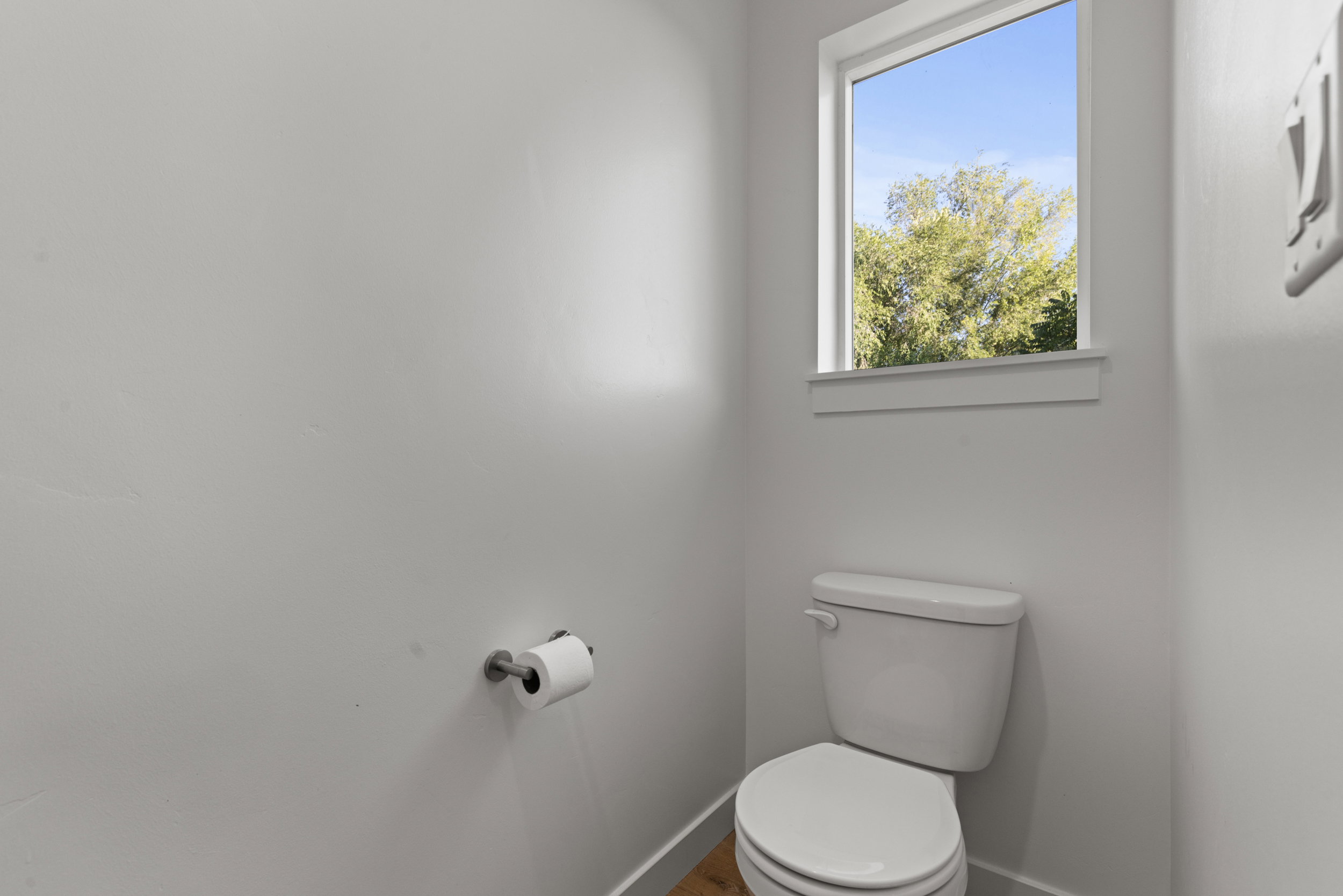 Bathroom with toilet and baseboards