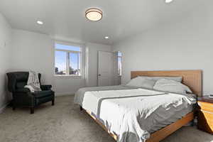 Carpeted bedroom featuring baseboards and recessed lighting