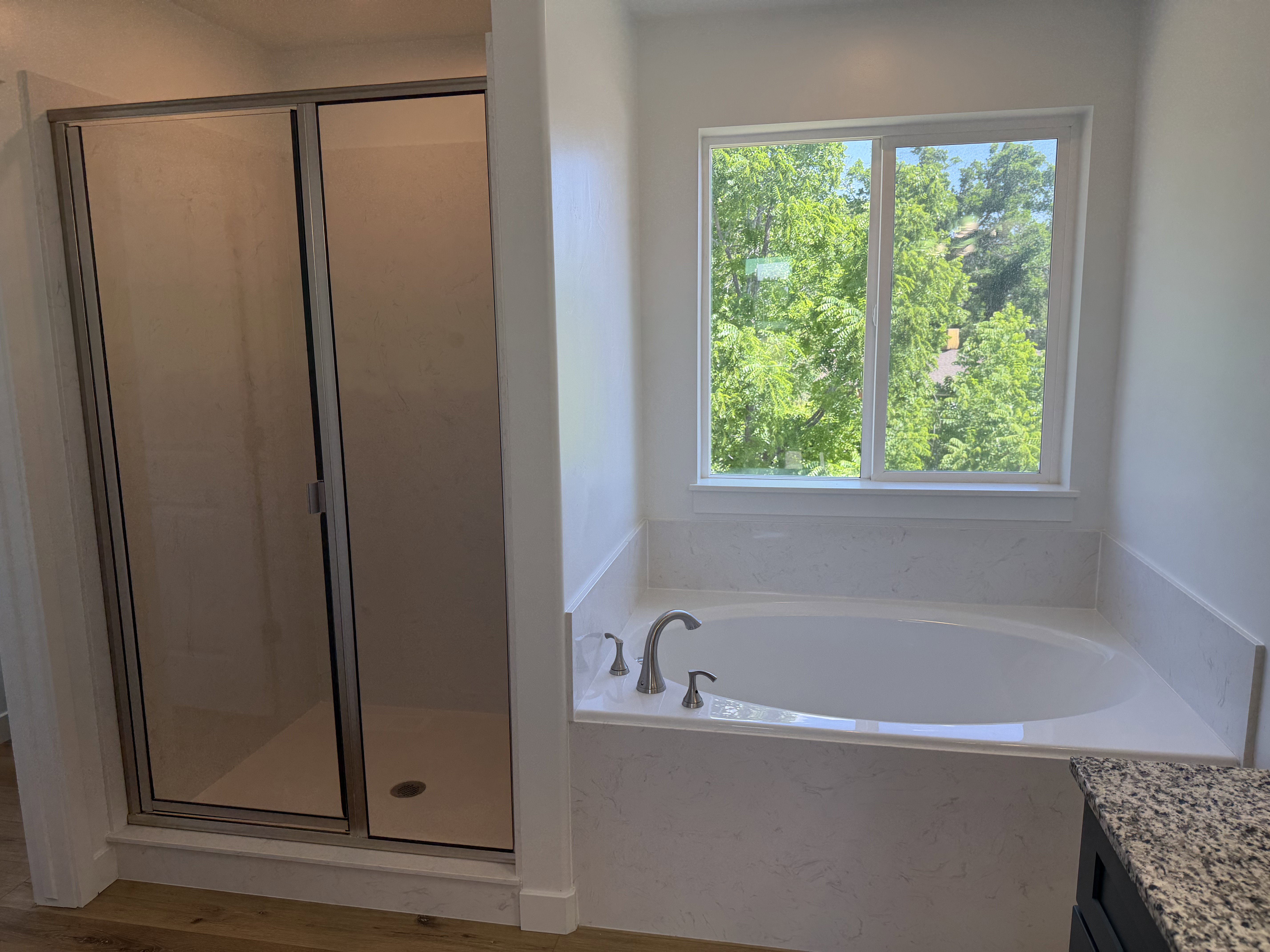 Soaking tub with a tiled surround and chrome fixtures