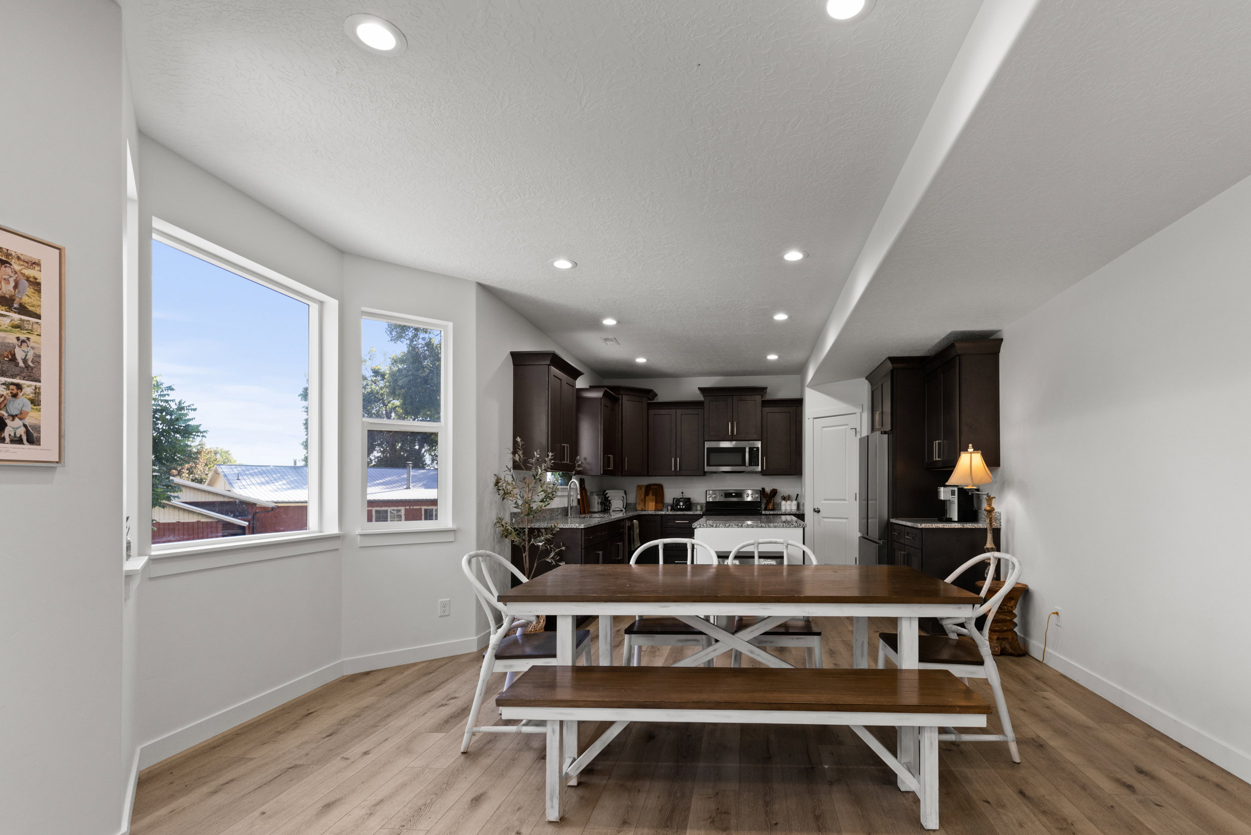 Dining room with recessed lighting and light wood-style floors