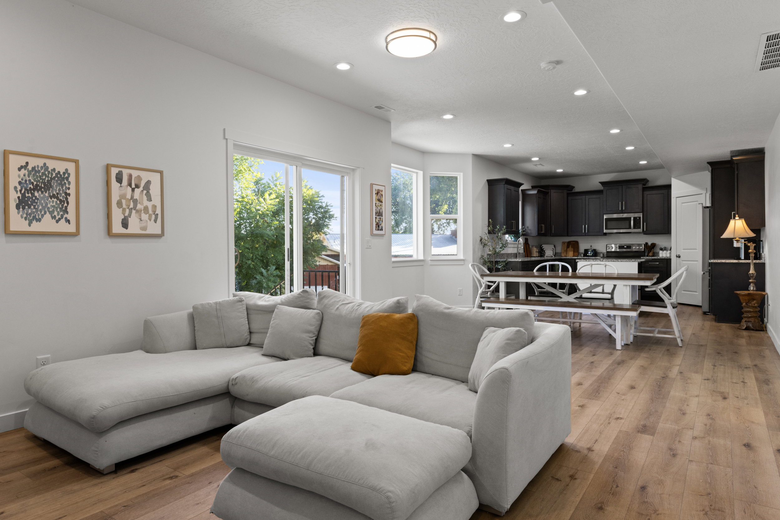 Living area with recessed lighting and light wood finished floors
