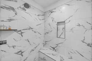Bathroom view of a marble finish shower