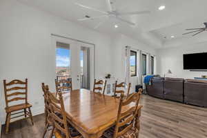 Dining room featuring ceiling fan, dark wood-style floors, french doors, and recessed lighting