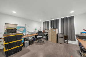 Home office featuring concrete flooring and recessed lighting