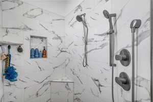 Bathroom view of a marble finish shower