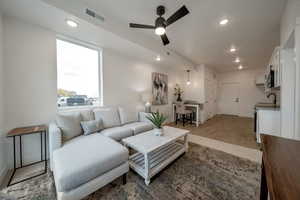 Living room with recessed lighting and ceiling fan