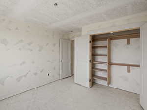 Unfurnished bedroom with a closet and baseboards