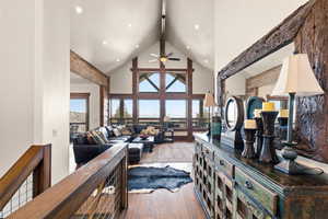 Living room with wood-type flooring and ceiling fan