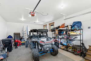 Garage featuring a garage door opener
