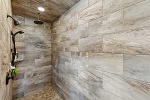Full bath with a tile shower