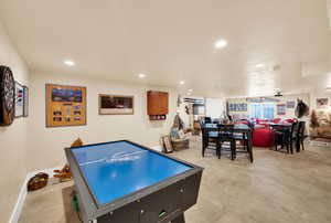 Game room with recessed lighting and concrete floors