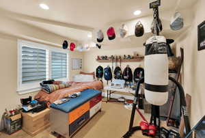 Bedroom with light carpet and recessed lighting