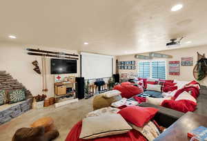 Living area with recessed lighting and carpet floors