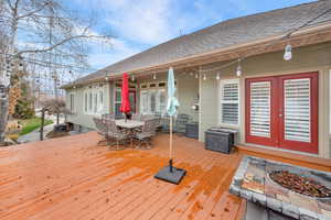 Deck with french doors and outdoor dining space