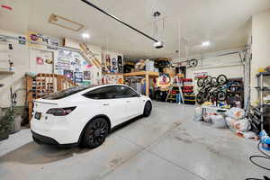 Garage featuring white fridge